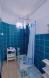 a room with a blue tiled wall
